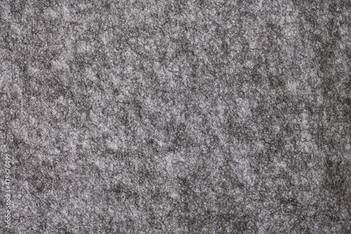 Texture of a gray felt panel surface. 
