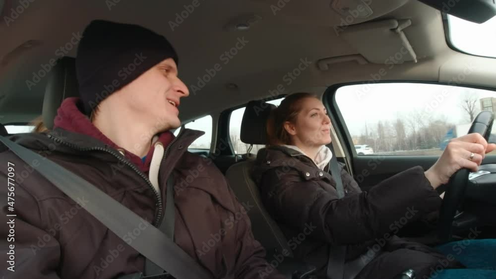 Happy man and woman singing in car driving Happy man and woman singing in car driving