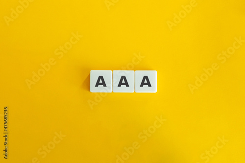 AAA Credit Rating and Score Banner. Block letters on bright orange background. Minimal aesthetics. photo