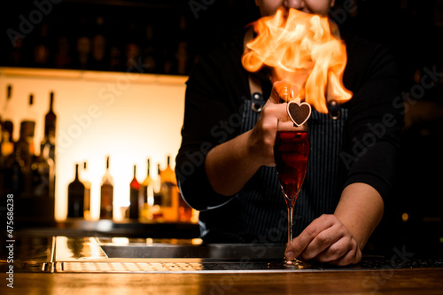 beautiful view on wine glass with alcoholic drink on bar counter