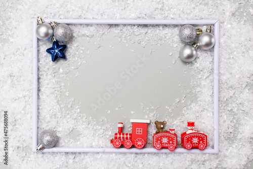 Christmas composition on the table frame, fir branches, Christmas balls, flat layout