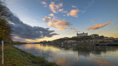 Sunset timelapse of Bratislava castle, Slovak parliament and the Danube river photo