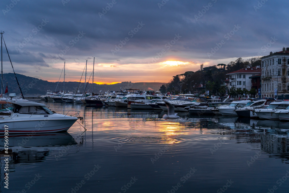 view of sailboats and yachts moored in the marina of  Istanbul, Turkey. Sunrise with colorful clouds and sky