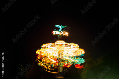 Kouvola, Finland - 28 August 2021: Rotating ride Taifun in amusement park Tykkimaki at night