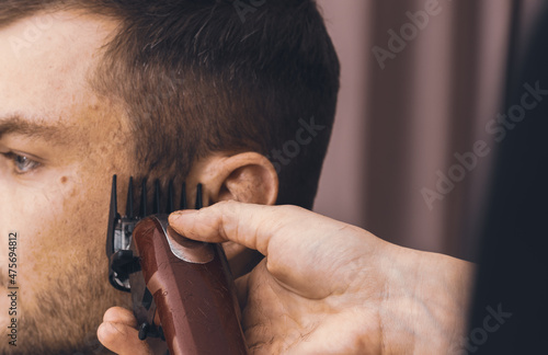 Haircutting process with a hair clipper.