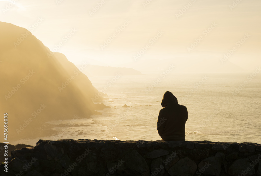 People chatting by the beach of Barrika at sunset, Bizkaia, Spain. People chatting by the beach of Barrika at sunset, Bizkaia, Spain.