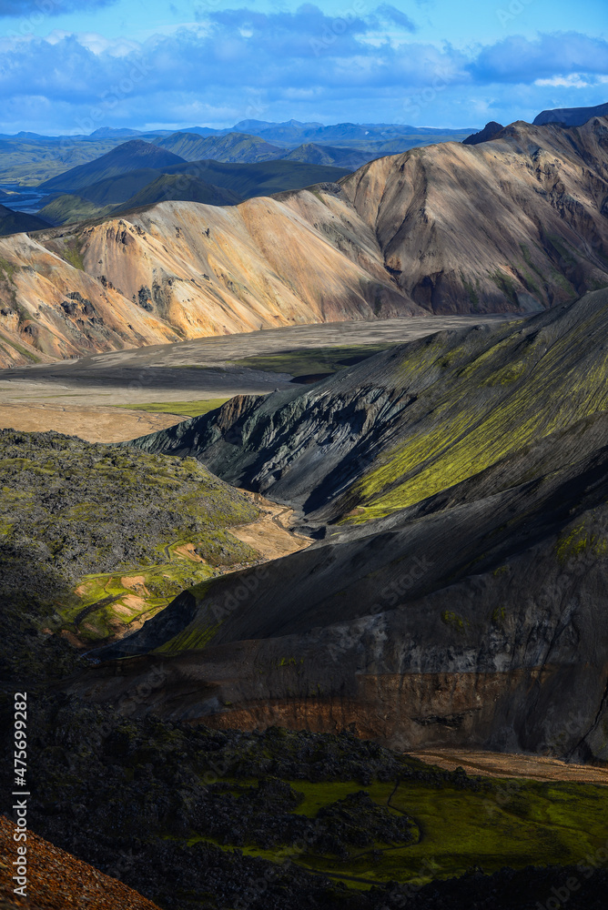 The rugged volcanic landscape of Landmannalaugar as seen from the hiking trail through the Laugahraun lava field at the foot of Brennisteinsalda volcano, Fjallabak Nature Reserve, Iceland	