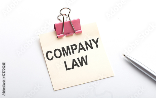 COMPANY LAW text on sticker with pen on the white background