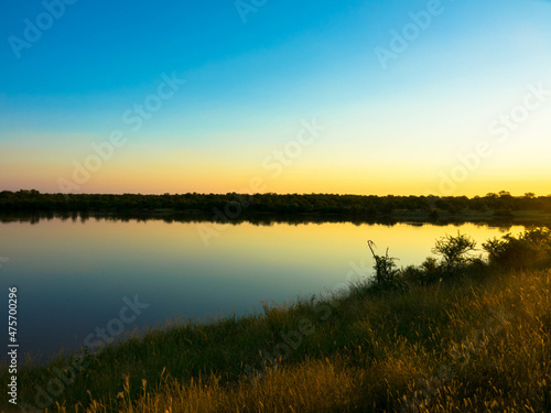 Magical sundown on the shore of a lake in South Africa  Kruger national park