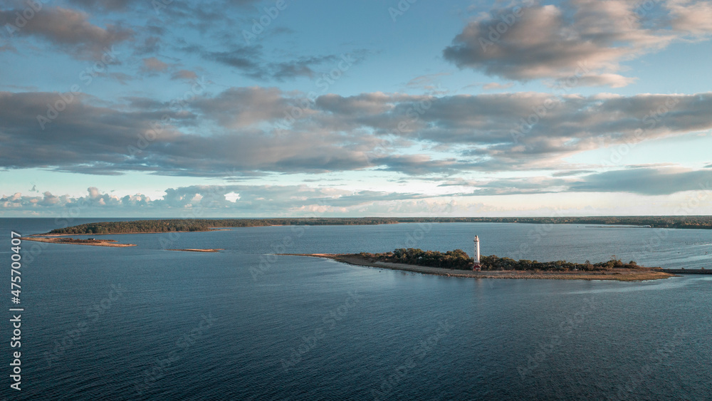 Coast and lighthouse Lange Erik on north coast of the island of Öland in the east of Sweden from above during sunset. Coast and lighthouse Lange Erik on north coast of the island of Öland in the east of Sweden from above during sunset.