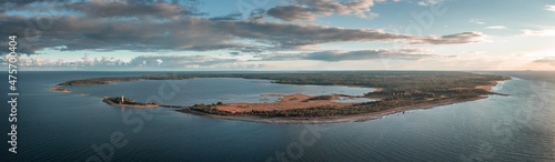 Coast and lighthouse Lange Erik on north coast of the island of Öland in the east of Sweden from above during sunset. photo