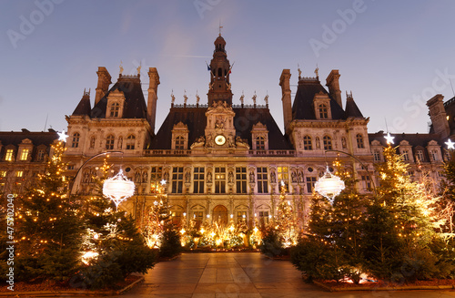 Photography Parisian City Hall decorated with Christmas trees for winter holidays at night