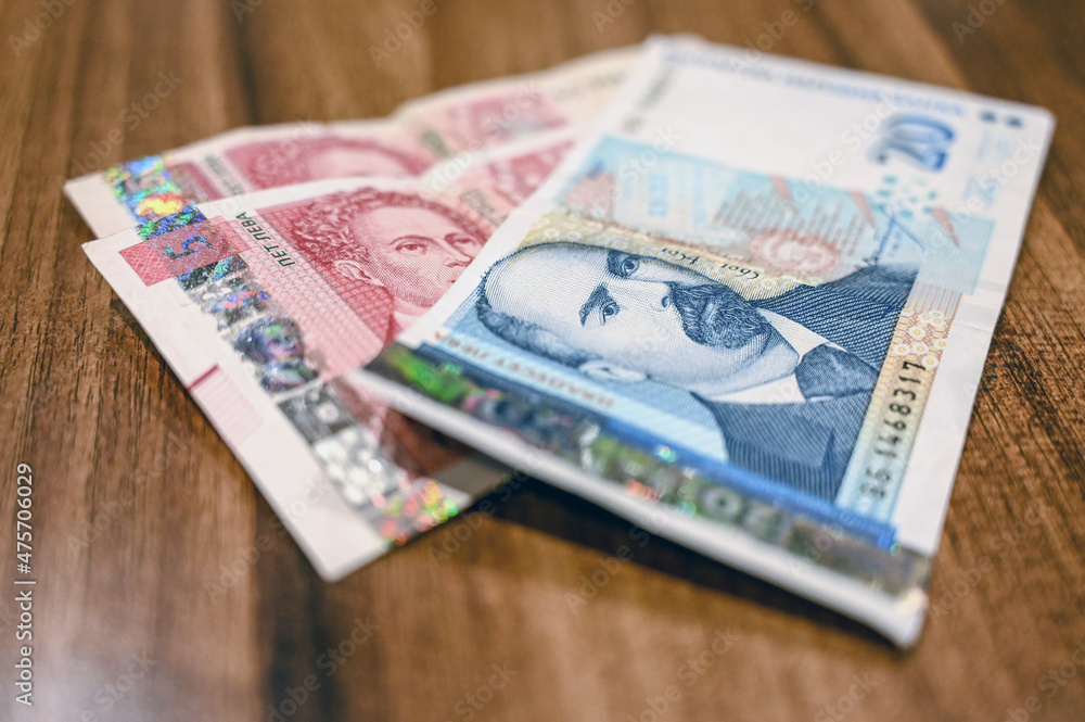 Bulgarian money on the table. Bulgarian Levs. National Currency in Bulgaria. Close up of 20 and 5 lev bills and coins. Bulgarian money on the table. Bulgarian Levs. National Currency in Bulgaria. Close up of 20 and 5 lev bills and coins.