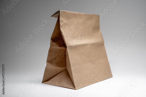 paper shopping bag on gray isolated background