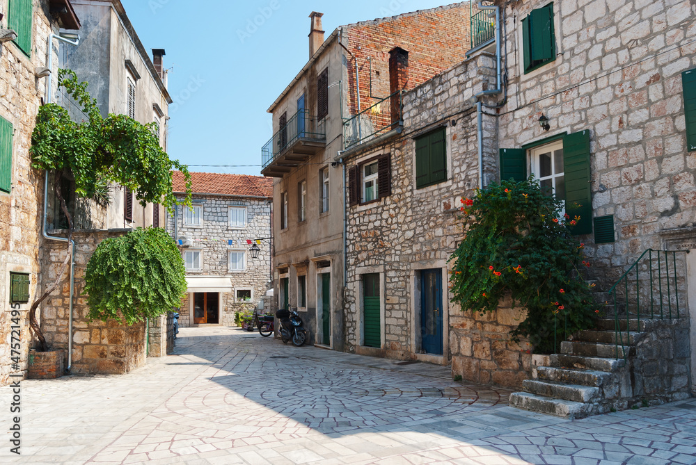 Street view, sity of Stari Grad on Hvar Island, Croatia, mediterranean architecture, plants and flowers