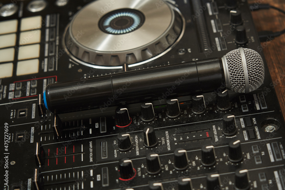 close-up of the microphone, which lies on the dj console.