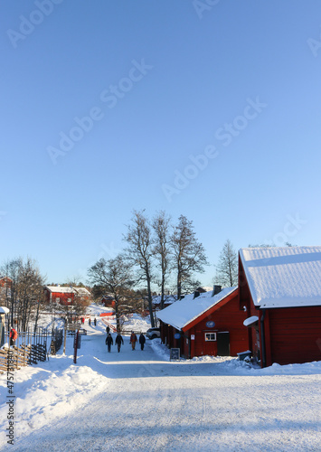Photography Traditional snow-covered red Swedish houses, in Tyresö forest, south of Stockholm, Sweden