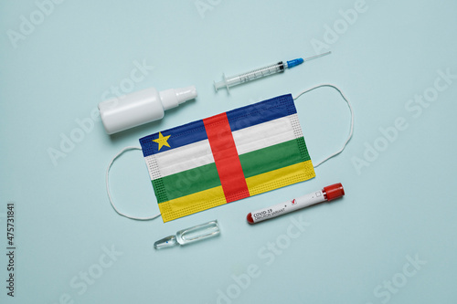 Blood tube for test detection of virus Covid-19 Omicron Variant with positive result, medicine mask with Central African Republic flag superimposed and vaccine.  New Variant of the Covid-19 Omicron