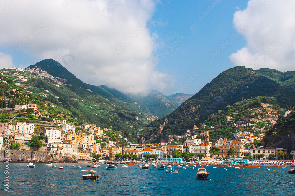 View of Minori on the vibrant Amalfi coast from a boat in the sea, Italy.