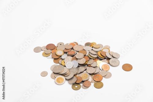Many kind of coin country pile up on white background.
