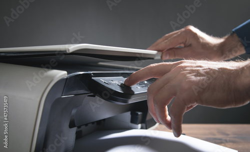 Wallpaper Mural Man copying and scanning documents in office. Torontodigital.ca