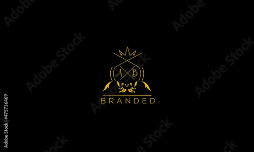 AB is a branded luxury logo with golden color and black background.