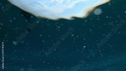 Ocean surface from below, camera sunken underwater