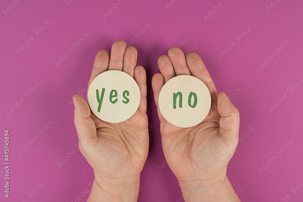 The words yes and no are standing on round signs, communication symbol, making a decision, business concept, minimalism The words yes and no are standing on round signs, communication symbol, making a decision, business concept, minimalism