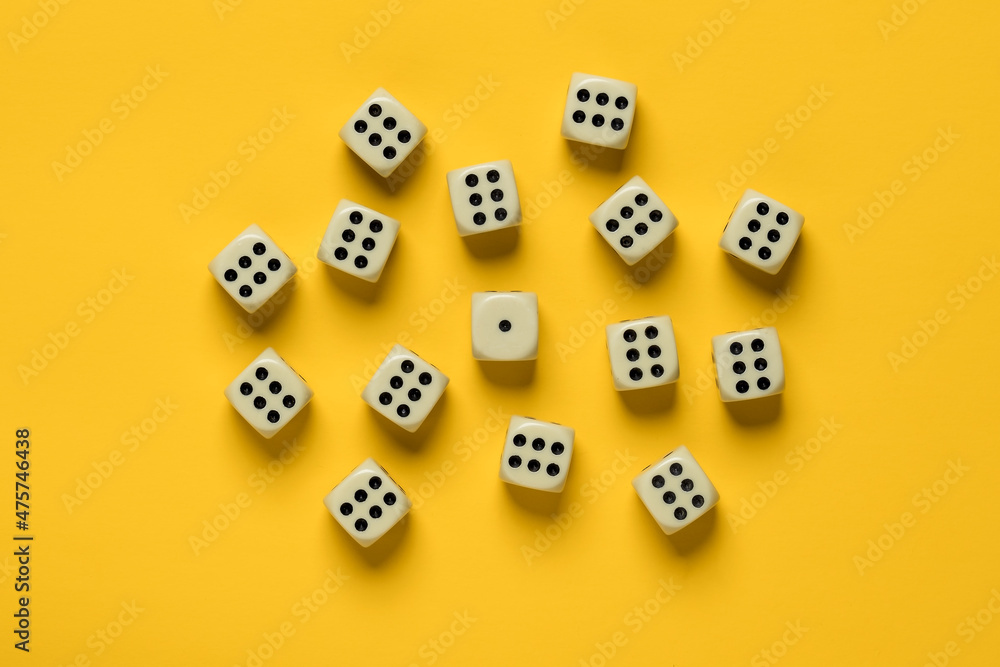 Dice on a yellow background, many sixes surrounded one unit. Top view. Dice on a yellow background, many sixes surrounded one unit. Top view.
