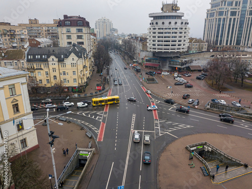 City street with a bike path in Kiev in cloudy weather. Aerial drone view.