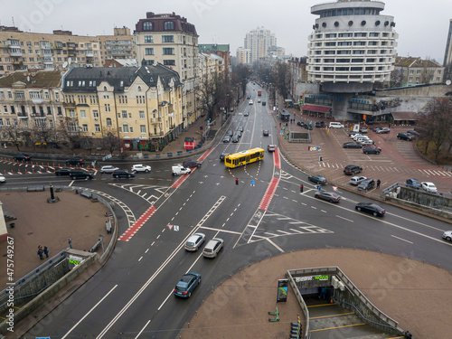 City street with a bike path in Kiev in cloudy weather. Aerial drone view.