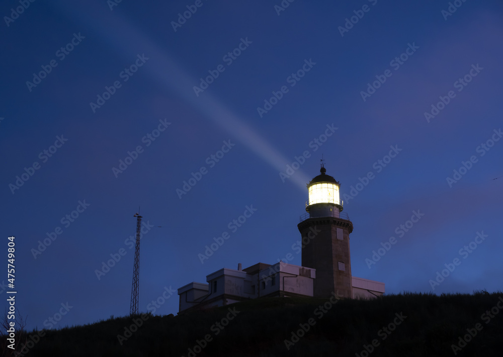 Matxitxako lighthouse illuminating at night, Bermeo in Euskadi