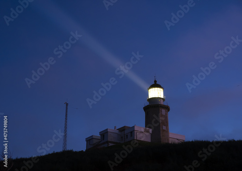 Matxitxako lighthouse illuminating at night, Bermeo in Euskadi