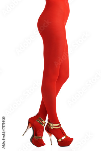 Sexy view of slim woman body lower part wearing red tights and high-heeled shoes