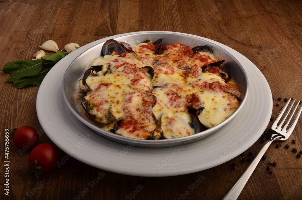 mussel with cheese souce in white plate mussel with cheese souce in white plate