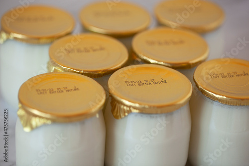 Yogurt in glass pots with the expiration date