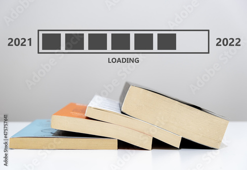 New year 2022 approaching concept. A layout that shows the new year is coming with books. Motivation, inspiration, planning.