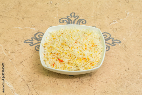 Pilaf, pulaw or pulau is a traditional way of cooking rice, with vegetables, lamb or beef, chicken or sometimes fish, and with spicy seasonings. photo