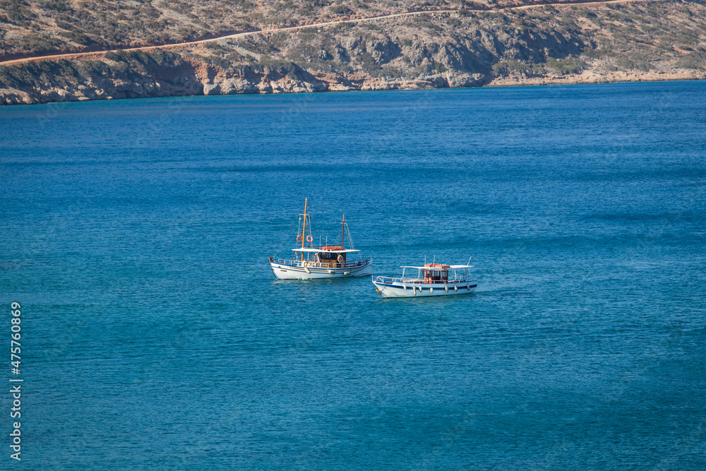 Anchored two fishing boats in open waters of the Mediterranean Sea.