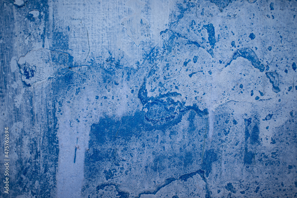 Blue paint on concrete walls covered with plaster.