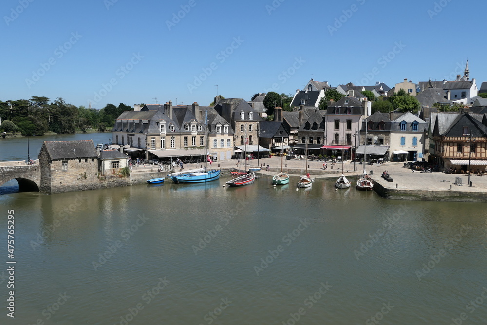 Fairytale beautiful ancient village in Brittany and a green river and canoe port.