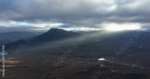 aerial footage of the mountains and munros of the torridon region of the north west highlands of scotland showing liathach, beinn eighe and sgurr dubh on a winters day