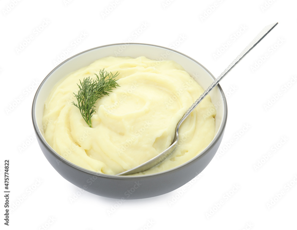 Bowl with freshly cooked homemade mashed potatoes and spoon isolated on white