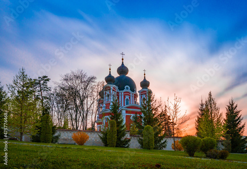 Curchi Monastery surrounded by a garden during the sunrise in Curchi, Moldova photo