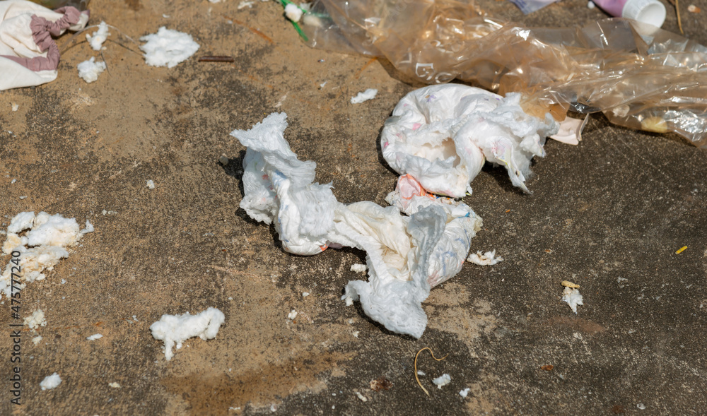 Disposable diaper waste in landfill. Environmental pollution. Stock