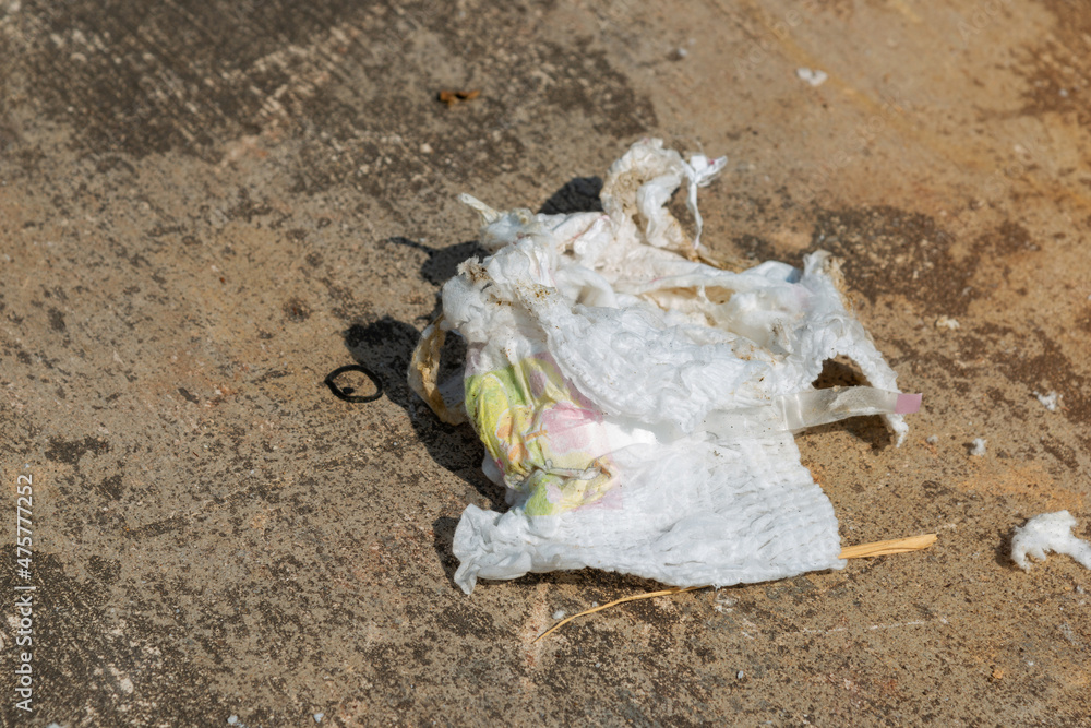 Disposable diaper waste in landfill. Environmental pollution. Stock