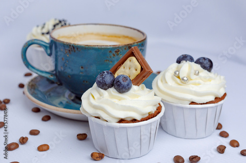 Chocolate cupcakes and coffee on craft paper