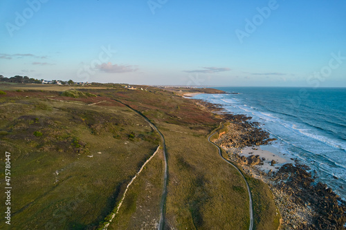 Aerial view of the coastline and a wavy sea in France photo