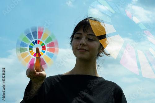 SDGsのシンボルカラーと女性のシルエット photo