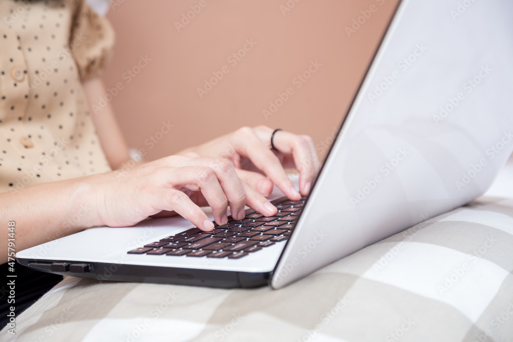 Female hands typing on laptop keyboard Female hands typing on laptop keyboard